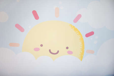 The sun, the clouds and the blue sky as he imagines his children and draws them.の写真素材