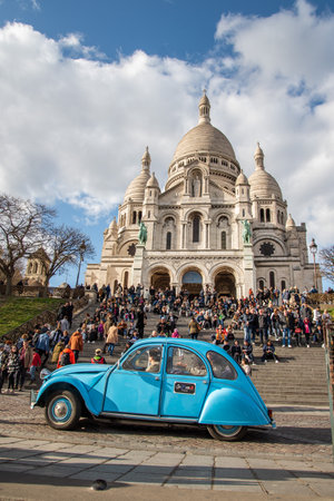 Tourists visit the Basilica Sacre Coeur in Paris, France.の写真素材
