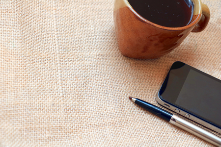 coffee smart phone and penの写真素材