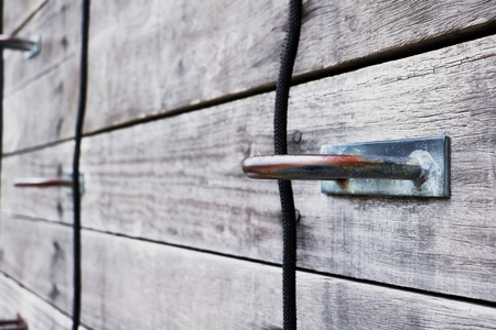 metal hooks on old wood background.の写真素材