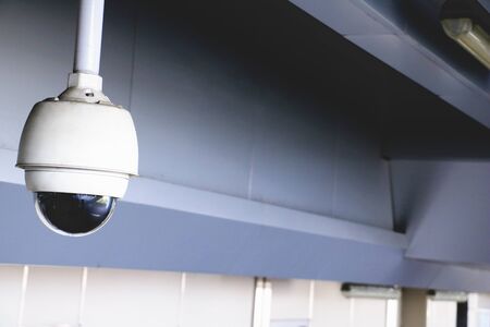 CCTV security camera operating in home. Image of CCTV security camera on background. cctv ball on safe ground.の写真素材