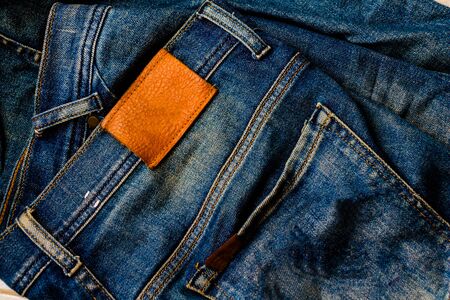 Close up Blue jeans background. Pocket on blue jeans. Label jeans and fashion background. photo concept fashion and background. の写真素材