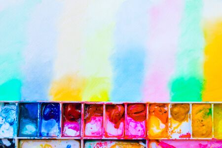 Top view paintbrush and Palette on drawing paper. Paintbrush with water colour. photo with copy...