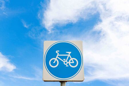 Bicycle warning Sing  on the sky.  Label on blue sky back ground. Copy space.の写真素材