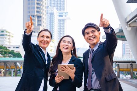 Business  teamwork. She use smart phone and talking with partner  on walkway.They are  talking with  business.Concept of  Business  teamwork, success and partner.の写真素材
