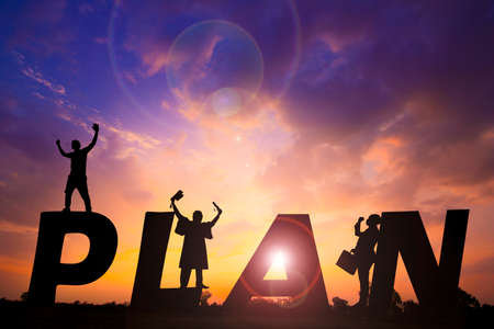 PLAN word Silhouette sunset background.They are standing between PLAN word. expectation ,objective,...