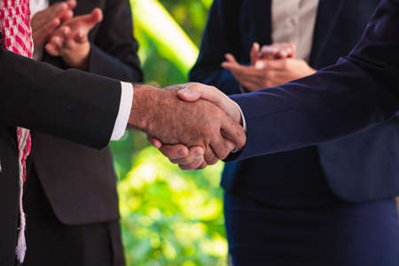 Body part Muslim  Arab business man Check hand.They are shake hands  in office.Photo concept  business and team work.の写真素材
