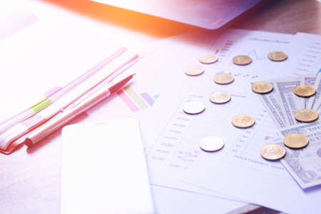 Coins and banknotes on the desk. Business concept. Selective focus.