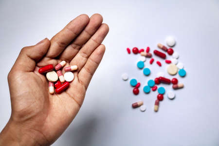 Close â up medicine on hand.A man holding  medicine.They are on pill background.Drug,remedy,hard drug,Photo Healthy lifestyle concept and good healthy.の写真素材