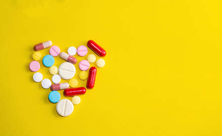 Close â up medicine on hand.A man holding  medicine.They are on pill background.Drug,remedy,hard drug,Photo Healthy lifestyle concept and good healthy.の写真素材