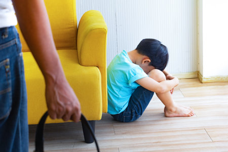 Portrait Asian cute boy.Child boy standing with yellow sofa in room.lovely,nice,development.photo concept knowledge and  Kid portrait.の写真素材