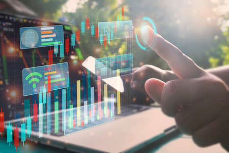 Saving money.Hand putting money coin stack and financial charts showing growing.Stock Market,graph,...