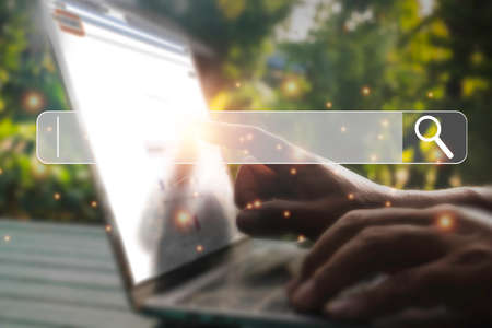Hand man using laptop and Searching browsing data on the Internet online.network,media,...