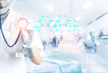 A hand holding red heart with heart wave.She is hand holding it on blue background.heart health,happy volunteer charity,The photo shows the principle of caring and good health.の写真素材