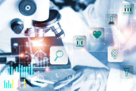 Young man using laptop.Man's hand hold smartphone play social media with communication icon.network,media, communication icon,Digital Web,Photo concept of Social media.の写真素材