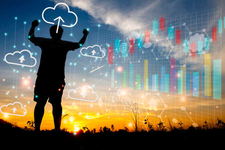Silhouette young man standing with ccloud uploading data on the Internet online.network,media,keyword,Digital Web,Photo concept information and Technology.の写真素材