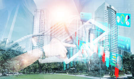 Double exposure picture. Picture mix  building city and businessman is Shake hands show Confident. Picture concept action man and business.の写真素材