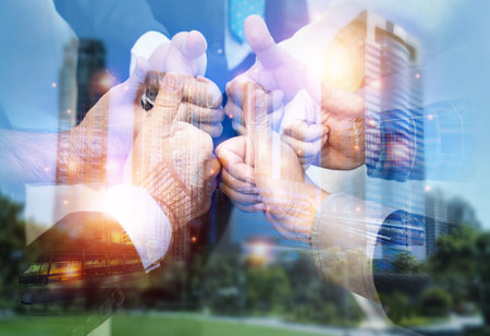 Double exposure picture. Picture mix  building city and businessman is Shake hands show Confident. Picture concept action man and business.の写真素材