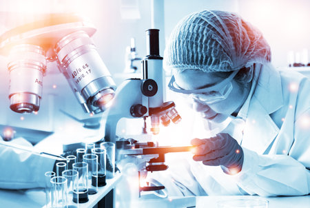 Double exposure microscope and Young woman scientific using equipment in the laboratory for research.Biotechnology,development,chemical,vaccine,COVID-19. Photo concept experimentation and research.の写真素材
