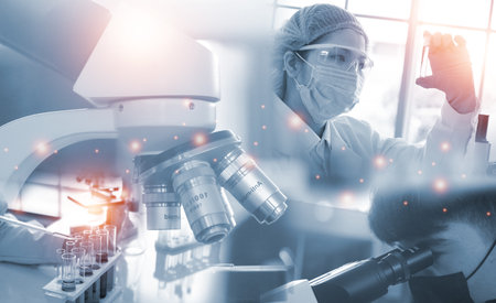 Double exposure microscope and Young woman scientific using equipment in the laboratory for research.Biotechnology,development,chemical,vaccine,COVID-19. Photo concept experimentation and research.の写真素材