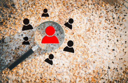 Magnifying glass on the old rusty metal background. Job search concept.の写真素材