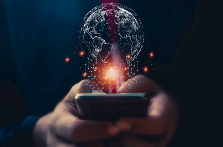 Hand use mobile phone and circle network communication technology for global.Data in the global computer social.telecommunication,earth cryptocurrency,Metaverse.の写真素材