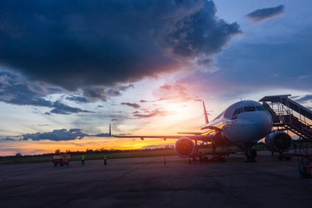 Airplane at the airport with beautiful sunset sky background, Airplaneの写真素材