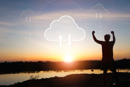 Silhouette young man standing and show hand with cloud uploading data on the Internet online. network, media, keyword, Digital  Web, Photo concept information and Technology.の写真素材