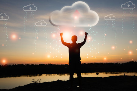 Silhouette young man standing and show hand with cloud uploading data on the Internet online. network, media, keyword, Digital  Web, Photo concept information and Technology.の写真素材