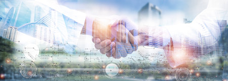Double exposure picture. Picture mix  building city and businessman is Shake hands show Confident.partnership,deal,leader.Picture concept action man and business.の写真素材