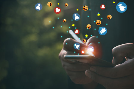 Young man use mobile smartphone.Man's hand hold smartphone play social media with communication icon.network,media, communication icon,Digital Web,Photo concept of Social media and Technology.の写真素材