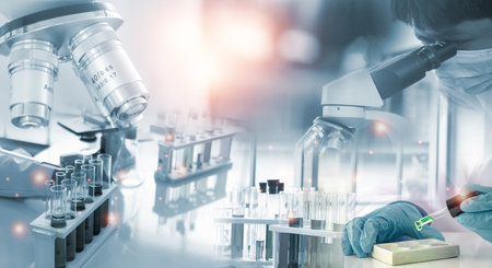 Double exposure microscope and Young woman scientific using equipment in the laboratory for research.Biotechnology,development,chemical,vaccine, Photo concept experimentation and research.の写真素材