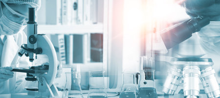 Double exposure microscope and Young woman scientific using equipment in the laboratory for research.Biotechnology,development,chemical,vaccine,Photo concept experimentation and research.の写真素材