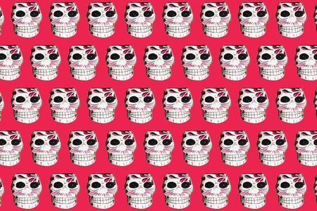 Day of the day skull faces pattern on a red backgroundの写真素材