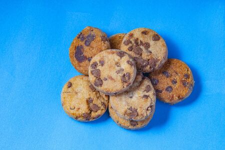 Chocolate chips cookies on a blue background