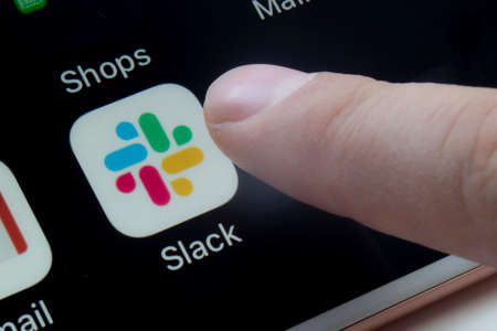 Calgary, Alberta, Canada. March 12, 2020.A person about to use Slack app which is a proprietary instant messaging platformのeditorial素材
