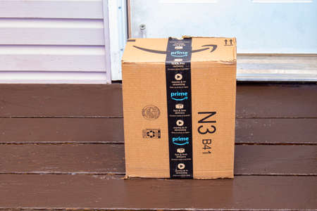 Calgary, Alberta, Canada. April 21, 2020. An Amazon Prime deliver box at a home entranceのeditorial素材