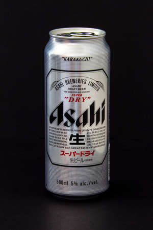 Calgary, Alberta, Canada. June 08, 2020. An isolated Asahi Tallboy Beer Can on a black background.のeditorial素材