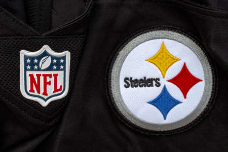 Calgary, Alberta, Canada. July 26 2020. A close up to a NFL and Steelers logo on a black jersey.