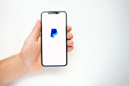 Calgary, Alberta, Canada. Aug 15, 2020. A person holding an iPhone 11 Pro Max on the back side...