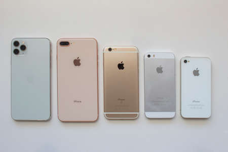 Calgary, Alberta, Canada. Aug 22, 2020. Several iPhone cameras back view on a white background.
