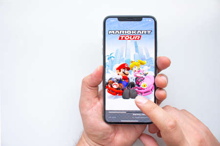 Calgary, Alberta, Canada. Sep 23, 2020. A person about to play Nintendo MarioKart Tour on an iPhone...