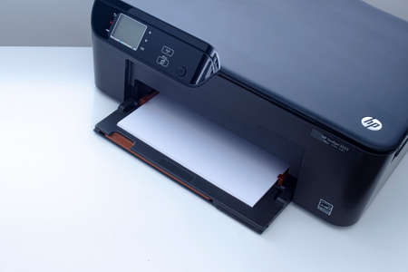 Calgary, Alberta, Canada. Nov. 19, 2020. An HP Deskjet 3522 e-All-in-One Printer on a white table..のeditorial素材
