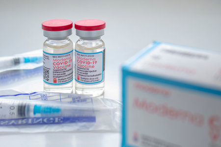 Calgary, Alberta. Canada. Jan 26, 2021. A couple of Moderna Covid-19 Vaccine vials with unopened...