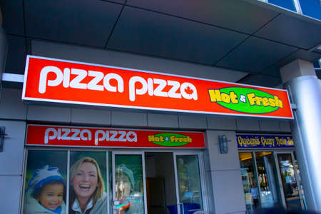 Toronto, Ontario, Canada. Feb, 20, 2021. A Pizza Pizza store sign. A Canadian franchised pizza quick-service restaurantのeditorial素材