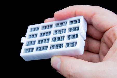 A person holding a Refrigerator Air Filter Replacement for kitchen Fridges. Fresh Flow Fridge Refrigerators.の写真素材