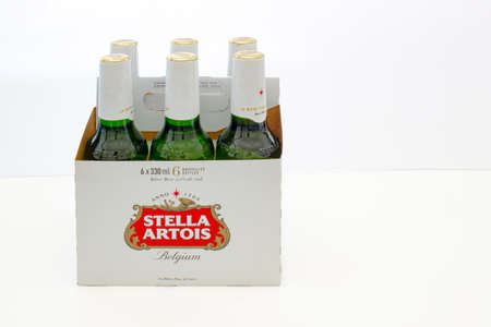 Calgary, Alberta, Canada. March 3, 2021. A Dutch Stella Artois a Belgian pilsner six pack on white backgroundのeditorial素材