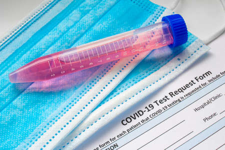 Testing for presence of virus. Centrifuge Tube containing a sample with a blank test form.の写真素材