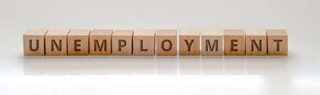 A Banner with wooden blocks with the text: "Unemployment" on a clear backgroundの写真素材
