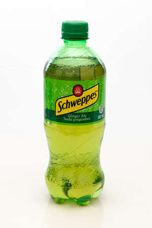 Calgary, Alberta, Canada. Apr 30, 2022. Schweppes Ginger Ale bottle of 591ml beverage brand that originated in the Republic of Geneva.のeditorial素材